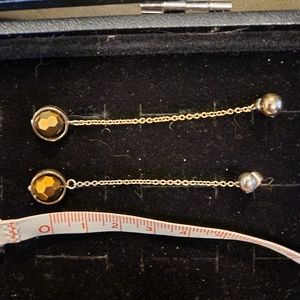 Dangling Earrings with Gold Geometric Ball Balanced.